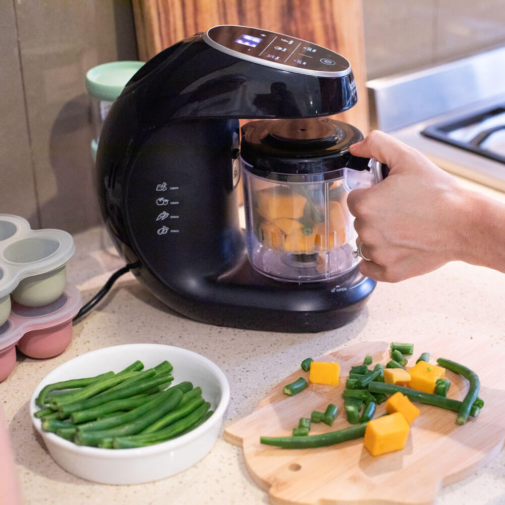KiddoKook Pro steaming vegetables for homemade baby food